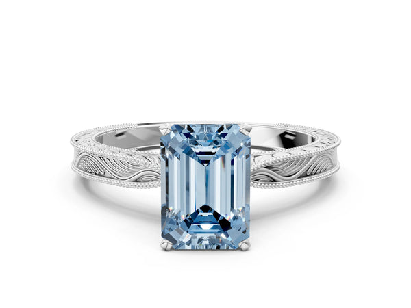 Platinum Fancy Blue Emerald Cut Solitaire Milgrain Engraved Band with Four-Prong Setting