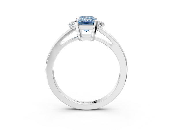 White gold Fancy Blue Emerald  Cut Three-Stone Solitaire Ring with Round Accent Diamonds and Four-Prong Setting