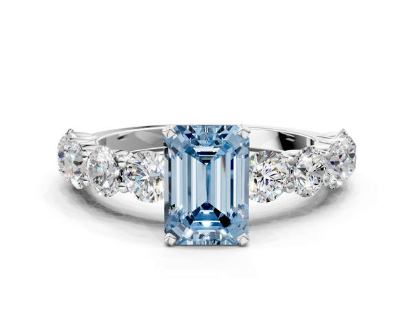 White gold Fancy Blue Emerald Cut Diamond Prong Setting with Side Stones on a Pave Band