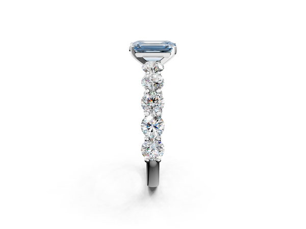White gold Fancy Blue Emerald Cut Diamond Prong Setting with Side Stones on a Pave Band