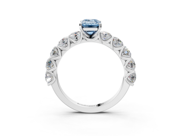 White gold Fancy Blue Emerald Cut Diamond Prong Setting with Side Stones on a Pave Band