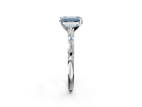 White gold Fancy Blue Emerald Cut Diamond Solitaire with Side Baguettes and Channel Set Band