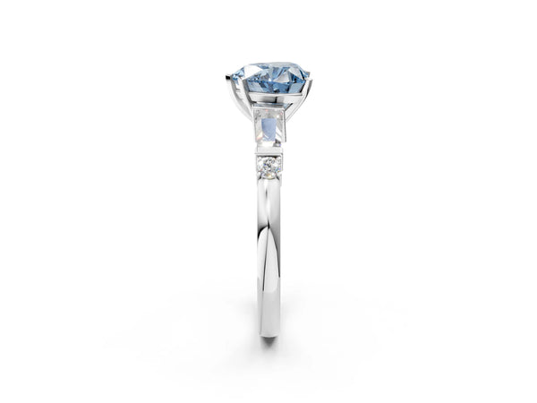 White gold Fancy Blue Heart  Cut Diamond Ring with Baguette Side Stones, Channel Set Band, and Four-Prong Setting