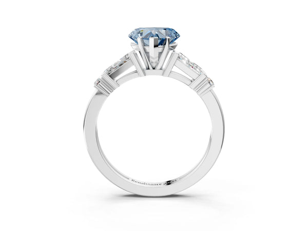 White gold Fancy Blue Heart  Cut Diamond Ring with Baguette Side Stones, Channel Set Band, and Four-Prong Setting