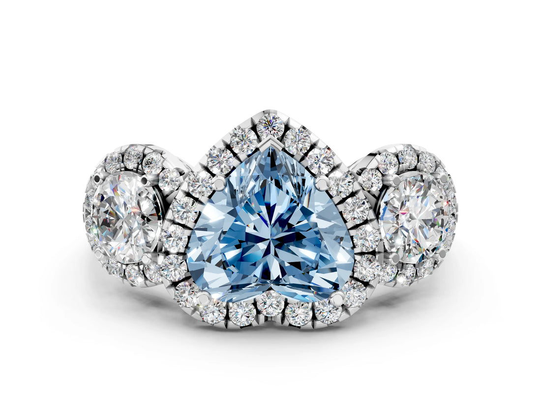 White gold Fancy Blue Heart Cut Diamond Three-Stone Halo Ring with Prong Setting and Pavé Accents