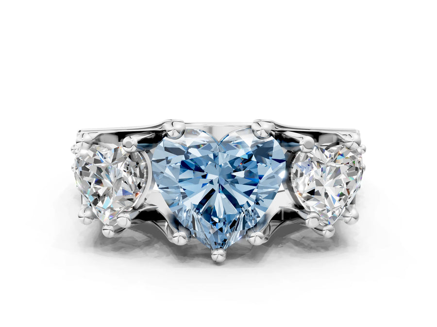 White gold Fancy Blue Heart Cut Diamond Three-Stone Ring with Channel Set Band and Four-Prong Setting