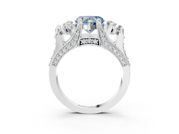 White gold Fancy Blue Heart Cut Diamond Three-Stone Ring with Channel Set Band and Four-Prong Setting