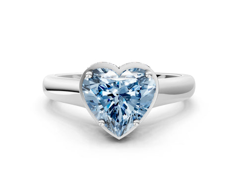 White gold Fancy Blue Heart Cut Solitaire Diamond Engagement Ring with Four-Prong Setting and Tapered Band