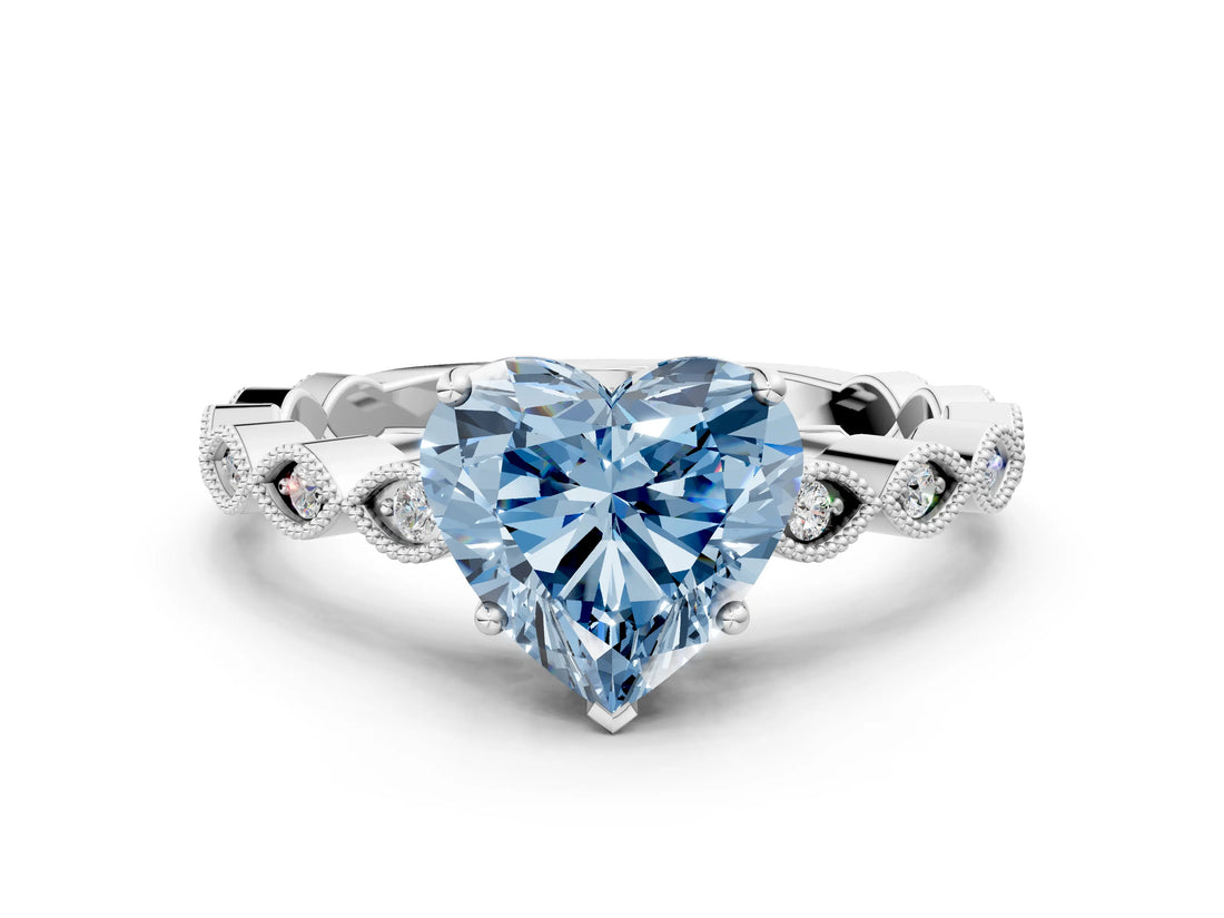 White gold Fancy Blue Heart Cut Solitaire Diamond Ring with Infinity Twist Band and Four-Prong Setting