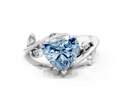 White gold Fancy Blue Heart Cut Solitaire Twist Engagement Ring with Leaf Accents and Prong Setting