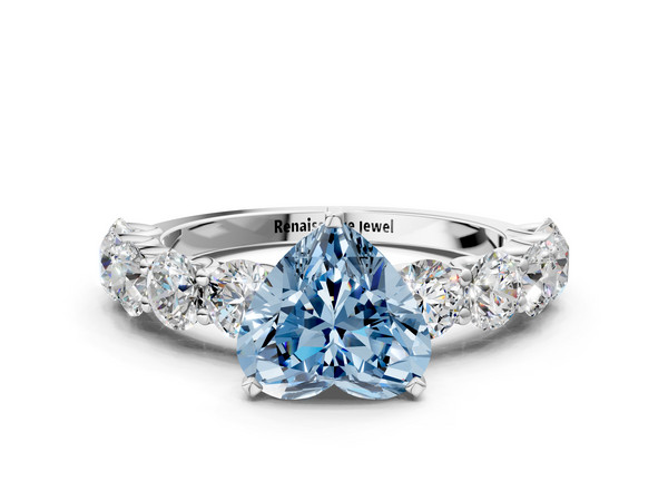 White gold Fancy Blue Heart Cut Diamond Prong Setting with Side Stones on a Pave Band
