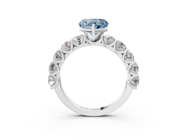 White gold Fancy Blue Heart Cut Diamond Prong Setting with Side Stones on a Pave Band