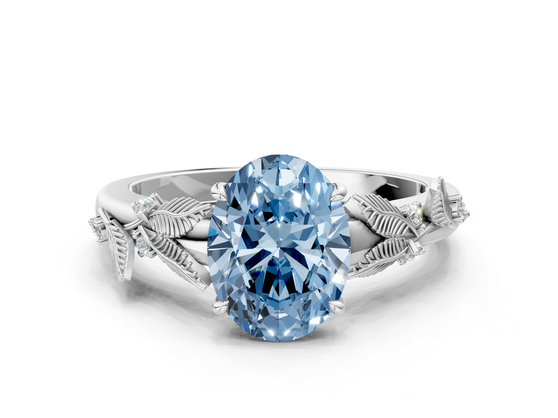 White gold Fancy Blue Oval  Brilliant Solitaire with Leaf Motif Band and Four-Prong Setting_63