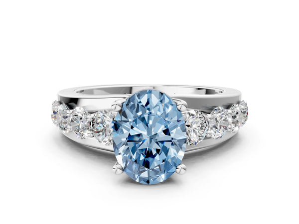 White gold Fancy Blue Oval  Brilliant Solitaire with Side Stones on a Pave Band and Four-Prong Setting