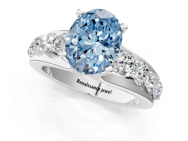 White gold Fancy Blue Oval  Brilliant Solitaire with Side Stones on a Pave Band and Four-Prong Setting