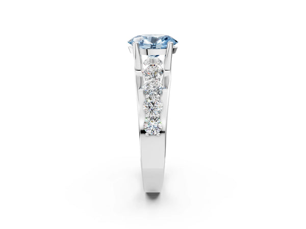 White gold Fancy Blue Oval  Brilliant Solitaire with Side Stones on a Pave Band and Four-Prong Setting