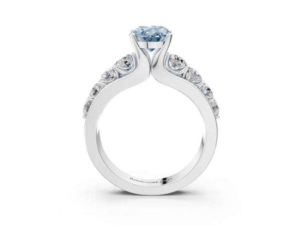 White gold Fancy Blue Oval  Brilliant Solitaire with Side Stones on a Pave Band and Four-Prong Setting