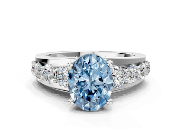 White gold Fancy Blue Oval  Brilliant Solitaire with Side Stones on a Pave Band and Four-Prong Setting