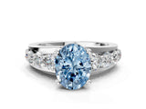 White gold Fancy Blue Oval  Brilliant Solitaire with Side Stones on a Pave Band and Four-Prong Setting_61