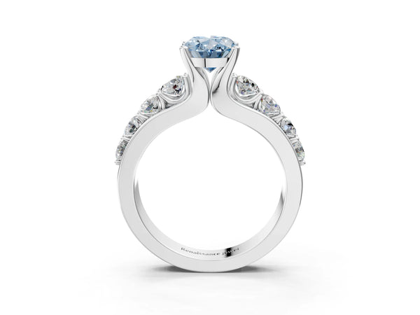 White gold Fancy Blue Oval  Brilliant Solitaire with Side Stones on a Pave Band and Four-Prong Setting