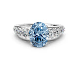 White gold Fancy Blue Oval Cut Brilliant Diamond Pavé Band with Six-Prong Setting