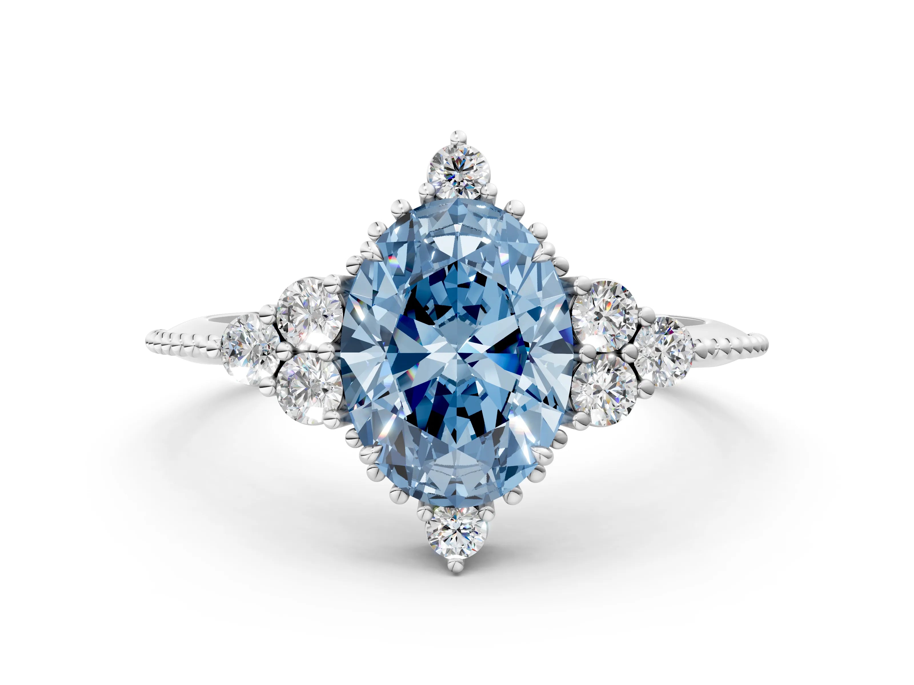 White gold Fancy Blue Oval Cut Brilliant Diamond with Cluster Setting on a Beaded Band and Four-Prong Setting