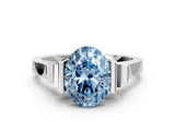 White gold Fancy Blue Oval Cut Brilliant Solitaire Diamond Ring with Channel Set Band and Bar Prong Setting