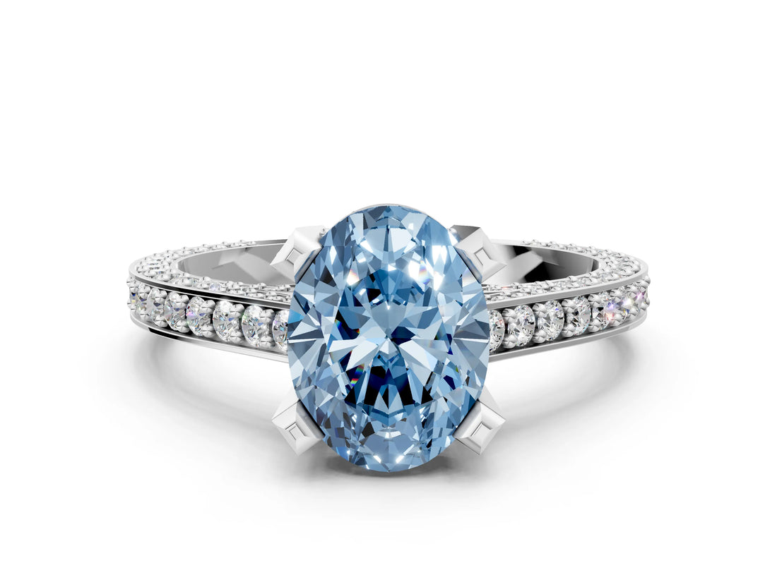 White gold Fancy Blue Oval Cut Brilliant Split Shank Pave Solitaire Ring with Four-Prong Setting