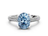 White gold Fancy Blue Oval Cut Brilliant Split Shank Pave Solitaire Ring with Four-Prong Setting
