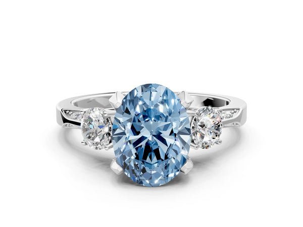 White gold Fancy Blue Oval Cut Brilliant Three-Stone Diamond Ring with Pavé Band and Four-Prong Setting