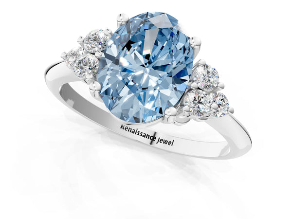 White gold Fancy Blue Oval Cut Cut Diamond Cluster Ring with Solitaire Band and Four-Prong Setting