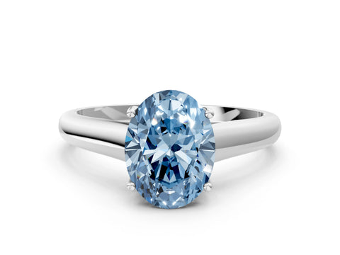 White gold Fancy Blue Oval Cut Cut Diamond Solitaire Engagement Ring with Tapered Plain Band and Four-Prong Setting