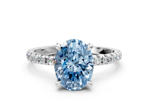 White gold Fancy Blue Oval Cut Diamond Brilliant Solitaire Ring with Pavé Band and Four-Prong Setting