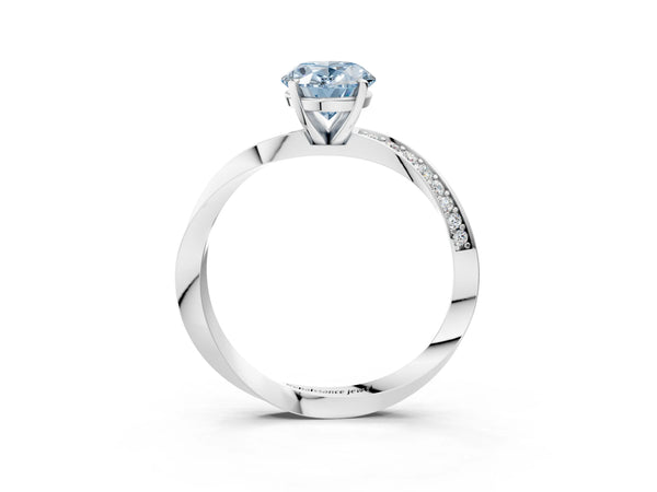 Platinum Fancy Blue Oval Cut Diamond Engagement Ring with Side Stone Accents and Four-Prong Setting