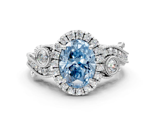 Platinum Fancy Blue Oval Cut Diamond Halo Ring with Milgrain Pavé Band and Four-Prong Setting