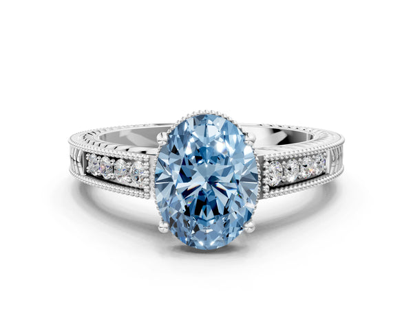 White gold Fancy Blue Oval Cut Diamond Ring with Milgrain Pavé Band and Four-Prong Setting