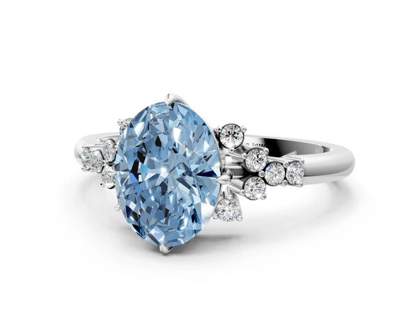 White gold Fancy Blue Oval Cut Diamond Ring with Side Stones and Four-Prong Setting