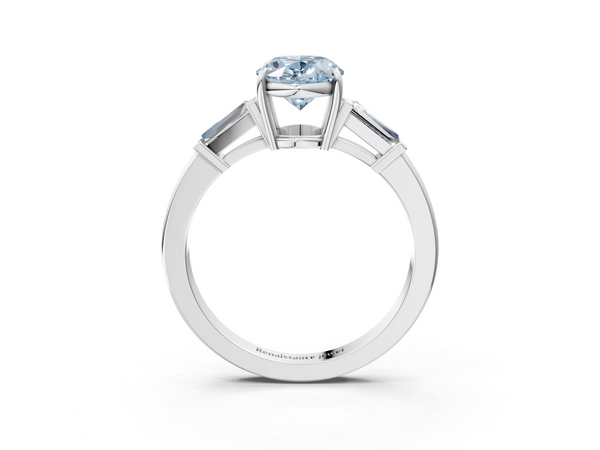 White gold Fancy Blue Oval  Cut Diamond Ring with Tapered Baguette Side Stones in Four-Prong Setting