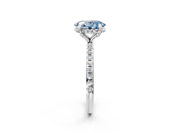 White gold Fancy Blue Oval Cut Diamond Solitaire Ring with Four-Prong Setting and Pavé Band