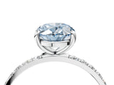 White gold Fancy Blue Oval Cut Diamond Solitaire Ring with Round  Pavé Band and Prong Setting_165