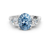 White gold Fancy Blue Oval Cut Diamond Three-Stone Engagement Ring with Prong Setting and Pavé Band