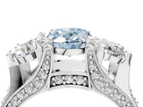 White gold Fancy Blue Oval Cut Diamond Three-Stone Ring with Channel Set Band and Four-Prong Setting_64