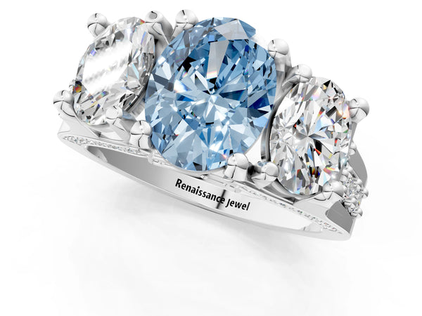 Platinum Fancy Blue Oval Cut Diamond Three-Stone Ring with Channel Set Band and Four-Prong Setting