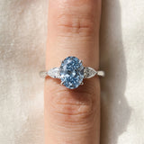 White gold Fancy Blue Oval Cut Diamond Three-Stone Ring with Pear  Side Stones and Prong Setting_189