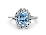 White gold Fancy Blue Oval Cut Halo Round Diamond Solitaire Ring with Pavé Band and Four-Prong Setting