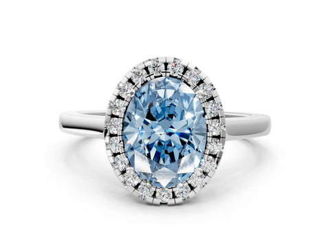 White gold Fancy Blue Oval Cut Halo Round Diamond Solitaire Ring with Pavé Band and Four-Prong Setting