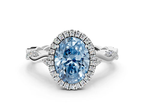 White gold Fancy Blue Oval Cut Halo Twist Band with Four-Prong Setting