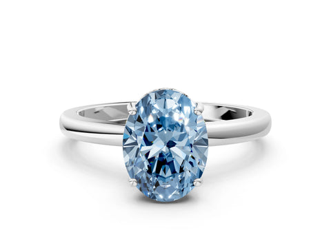 White gold Fancy Blue Oval Cut Solitaire Diamond Ring with Prong Setting and Plain Band