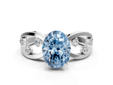 White gold Fancy Blue Oval  Cut Solitaire Diamond with Side Stones on Criss-Cross Band and Four-Prong Setting_3