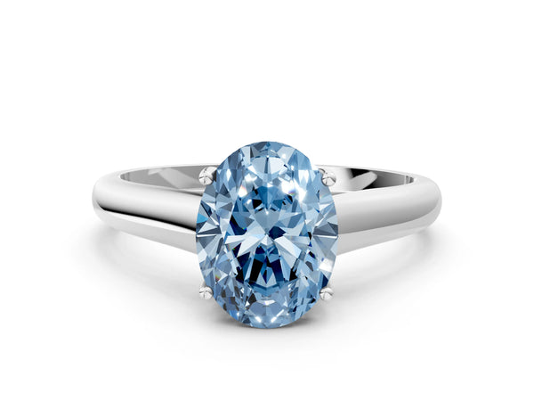 White gold Fancy Blue Oval Cut Solitaire Engagement Ring with Tapered Band and Four-Prong Setting